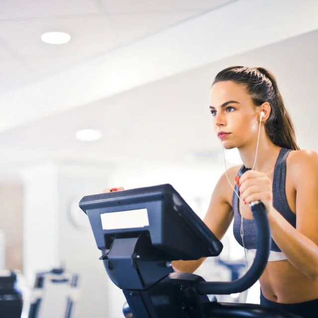 Woman exercising on a stationary bike