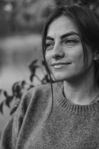 Nora smiling outdoors